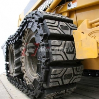 McLaren Rubber over-the-tire tracks on a John Deere 320 skid steer loader